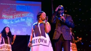 performers on stage holding microphones for Motor City Musical at GTS Theatre in Myrtle Beach, South Carolina, USA